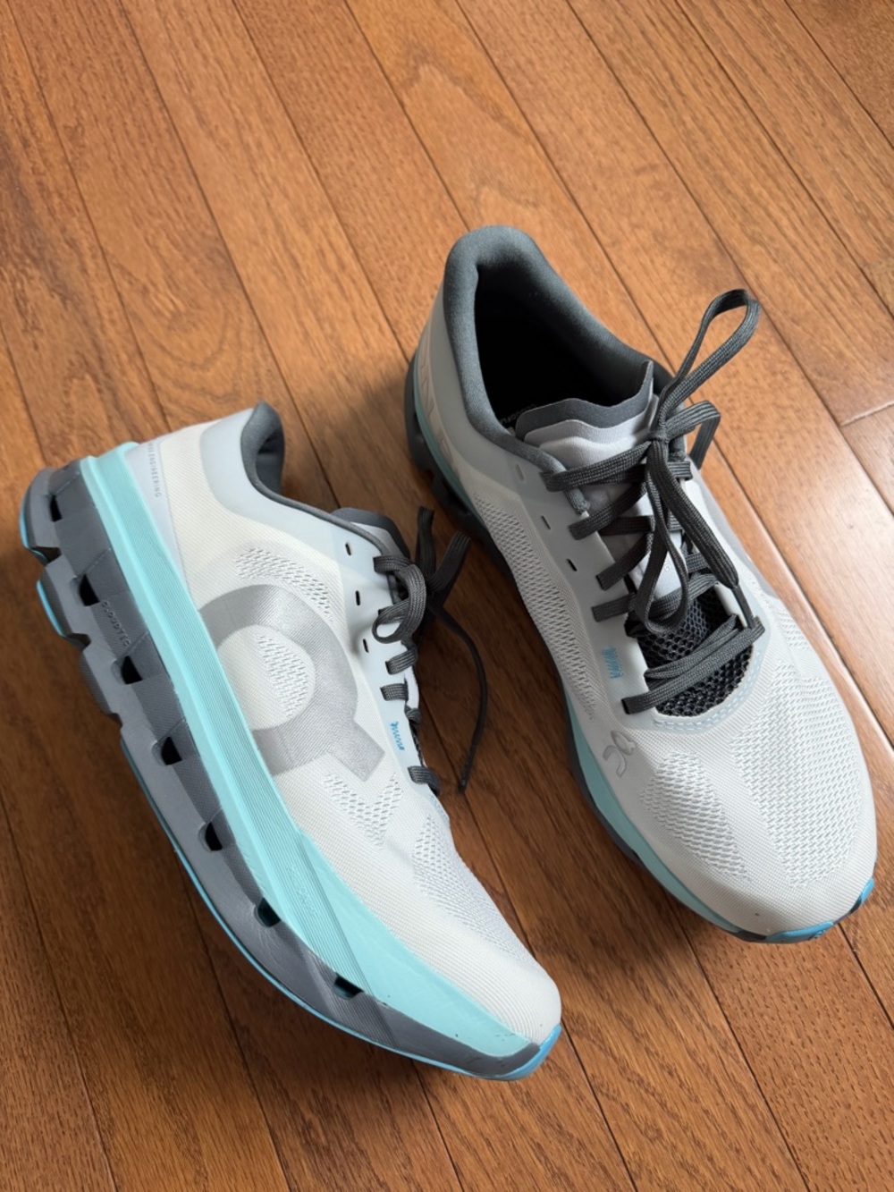 On Running Cloudsurfer Running Shoes in White + Light Blue